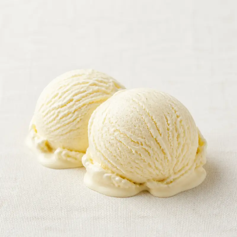 Vanilla Ice Cream, a nutrient-dense dairy food, photographed on a plain linen surface