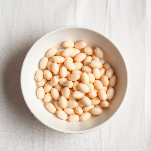 White Beans, a nutrient-dense legumes food, photographed on a plain linen surface